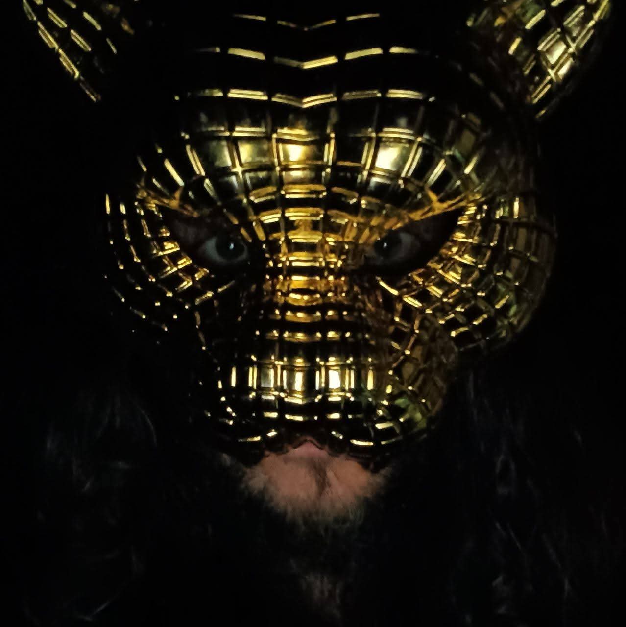 Dream wearing a gold cat mask